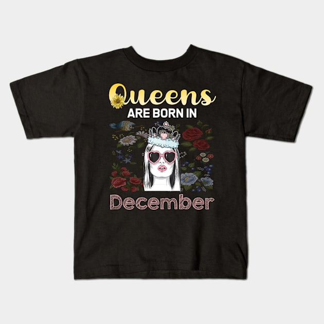 Queen face December Kids T-Shirt by symptomovertake